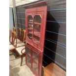 A PAINTED FULL LENGTH GLAZED CORNER CABINET