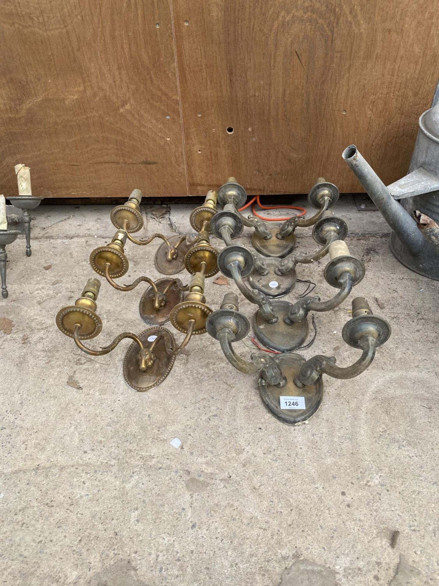 A COLLECTION OF SEVEN DECORATIVE BRASS LIGHT FITTINGS
