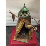 A BERGMAN STYLE COLD PAINTED BRONZE LAMP DEPICTING AN AFRICAN TRIBESMAN IN A TENT - HEIGHT