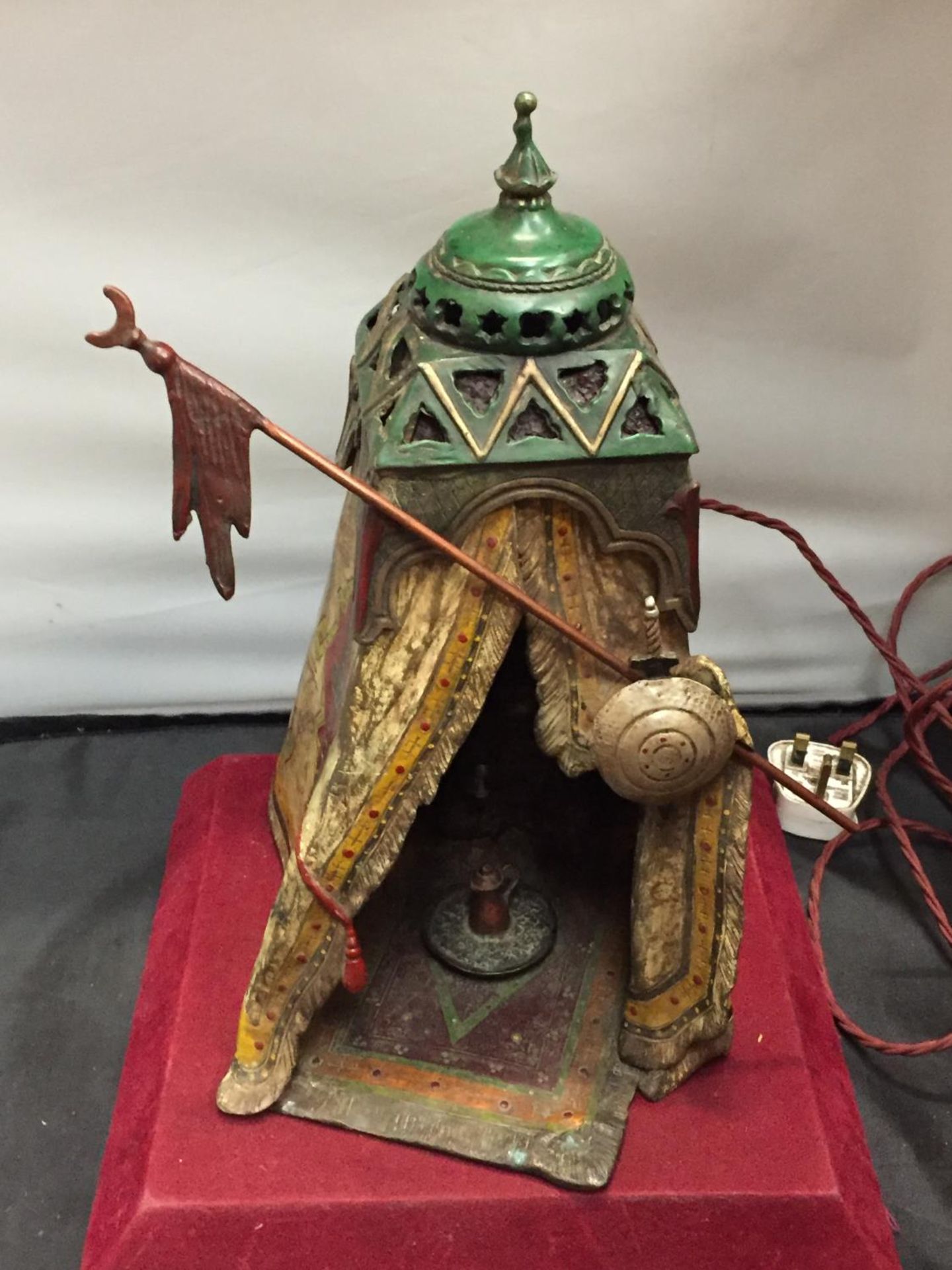 A BERGMAN STYLE COLD PAINTED BRONZE LAMP DEPICTING AN AFRICAN TRIBESMAN IN A TENT - HEIGHT