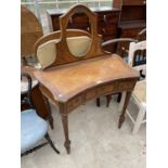 A CONTINENTAL WALNUT AND CROSSBANDED DRESSING TABLE (LACKING MIRROR) WITH THREE FRIEZE DRAWERS, ON