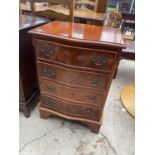 A YEW WOOD SERPENTINE CHEST OF FOUR DRAWERS, 19.5" WIDE