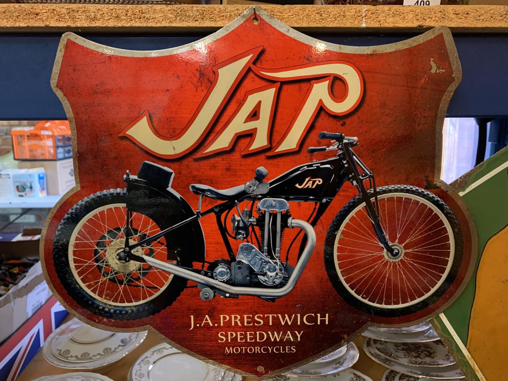 A METAL CUT OUT 'JAP' MOTORCYCLE SIGN - 43.5CM X 37CM