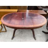 A REGENCY STYLE EXTENDING DINING TABLE