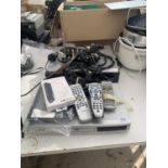 AN ASSORTMENT OF ELECTRICALS TO INCLUDE TWO DVD PLAYERS, REMOTE CONTROLS AND DVDS ETC