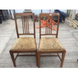 A PAIR OF LIGHT OAK DINING CHAIRS