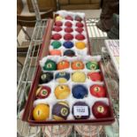 A SET OF POOL BALLS AND A SET OF SNOOKER BALLS