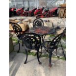 A DECORATIVE CAST IRON BISTRO SET WITH ROUND TABLE AND FOUR CHAIRS