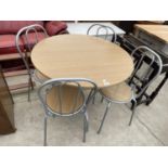 A CIRCULAR KITCHEN TABLE AND FOUR MATCHING CHAIRS