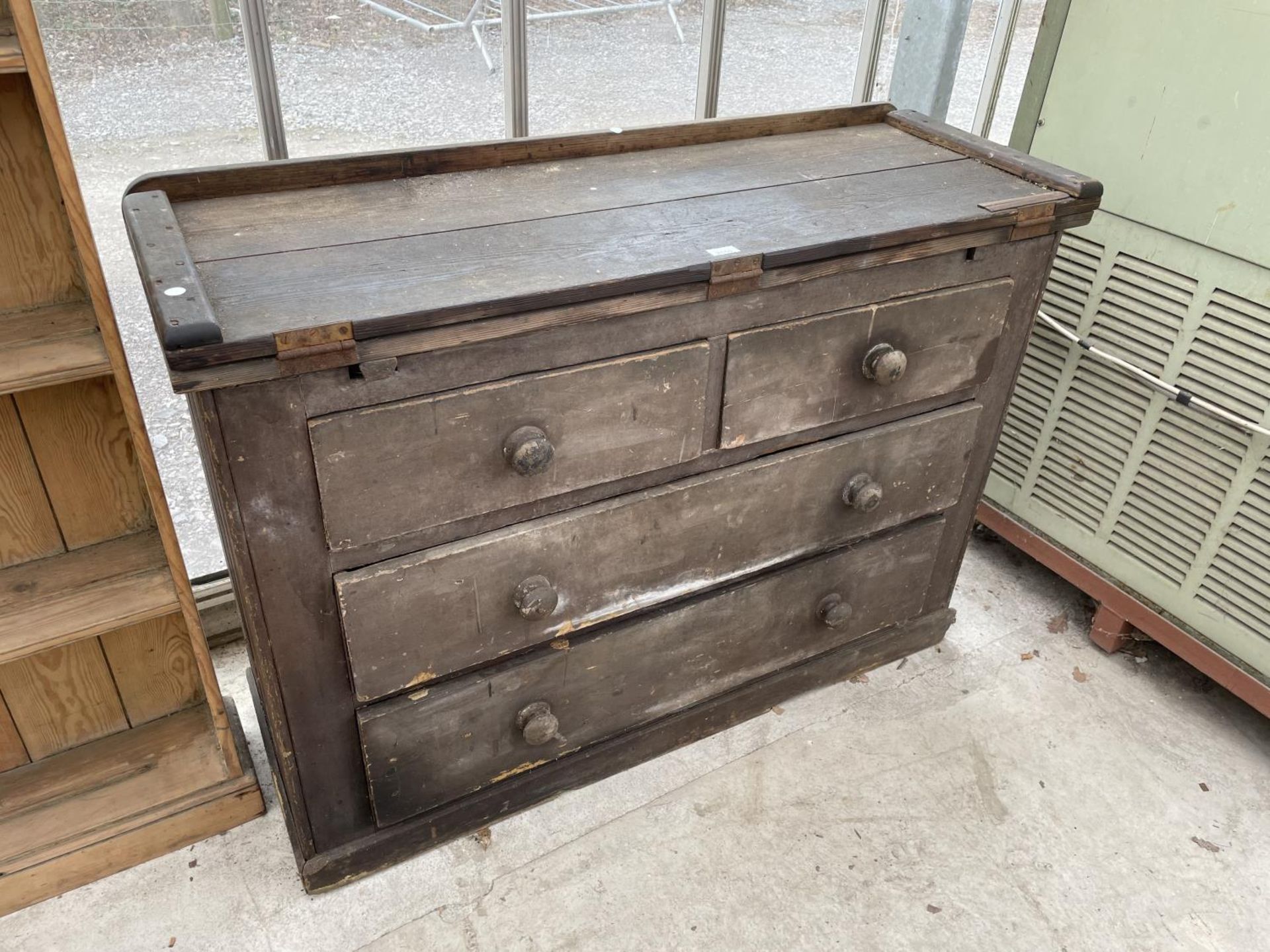 A VICTORIAN PINE CHEST OF TWO SHORT AND TWO LONG DRAWERS WITH FOLD-OVER WORK TOP