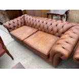 A TAN LEATHER LOW BACK TWO SEAT CHESTERFIELD SOFA