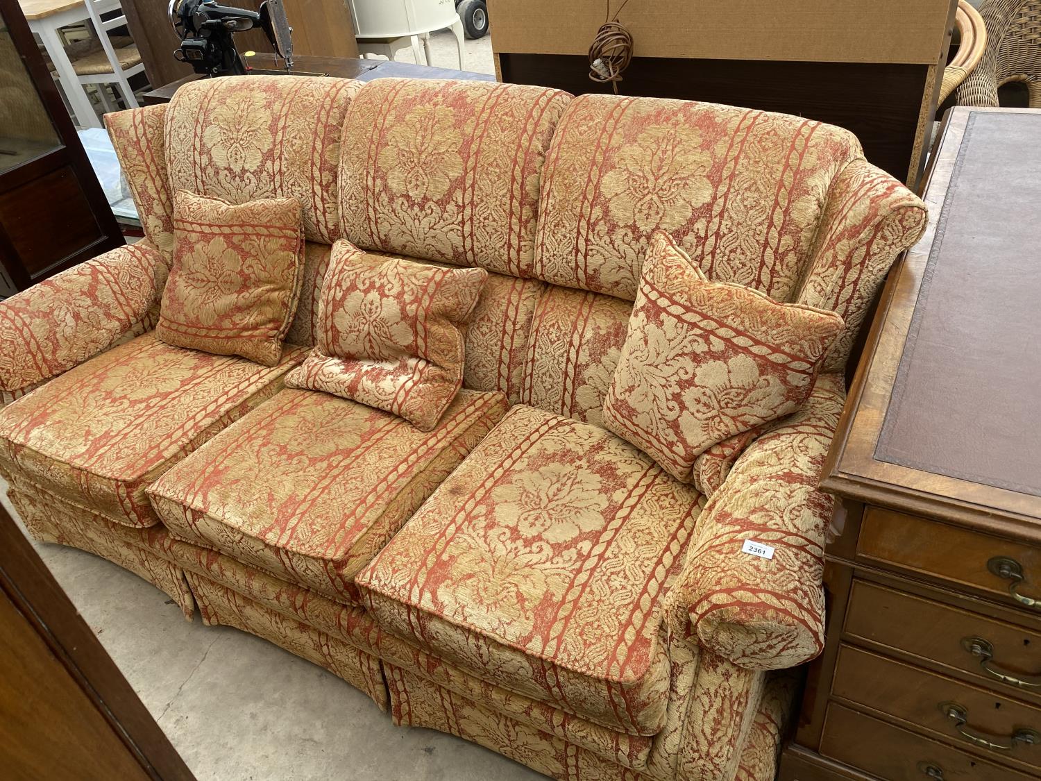 A PARKER KNOLL THREE SEATER WINGED SETTEE