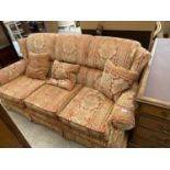 A PARKER KNOLL THREE SEATER WINGED SETTEE