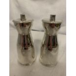 A PAIR OF SILVER SALT AND PEPPER SHAKERS