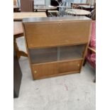 A MID 20TH CENTURY OAK BUREAU, 36" WIDE, WITH SLIDING DOORS TO THE BASE