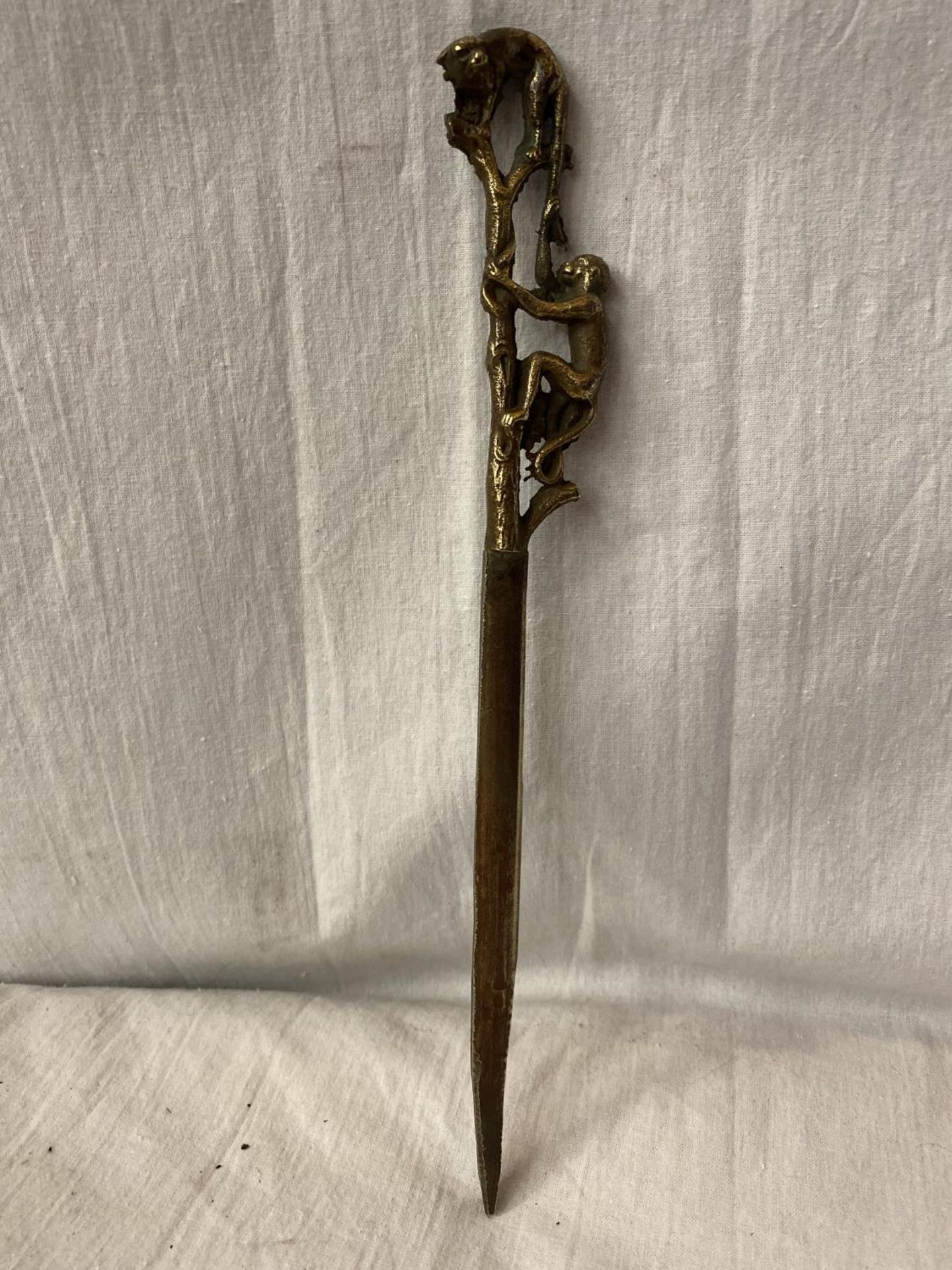 A VINTAGE BRASS LETTER OPENER WITH MONKEY DETAIL