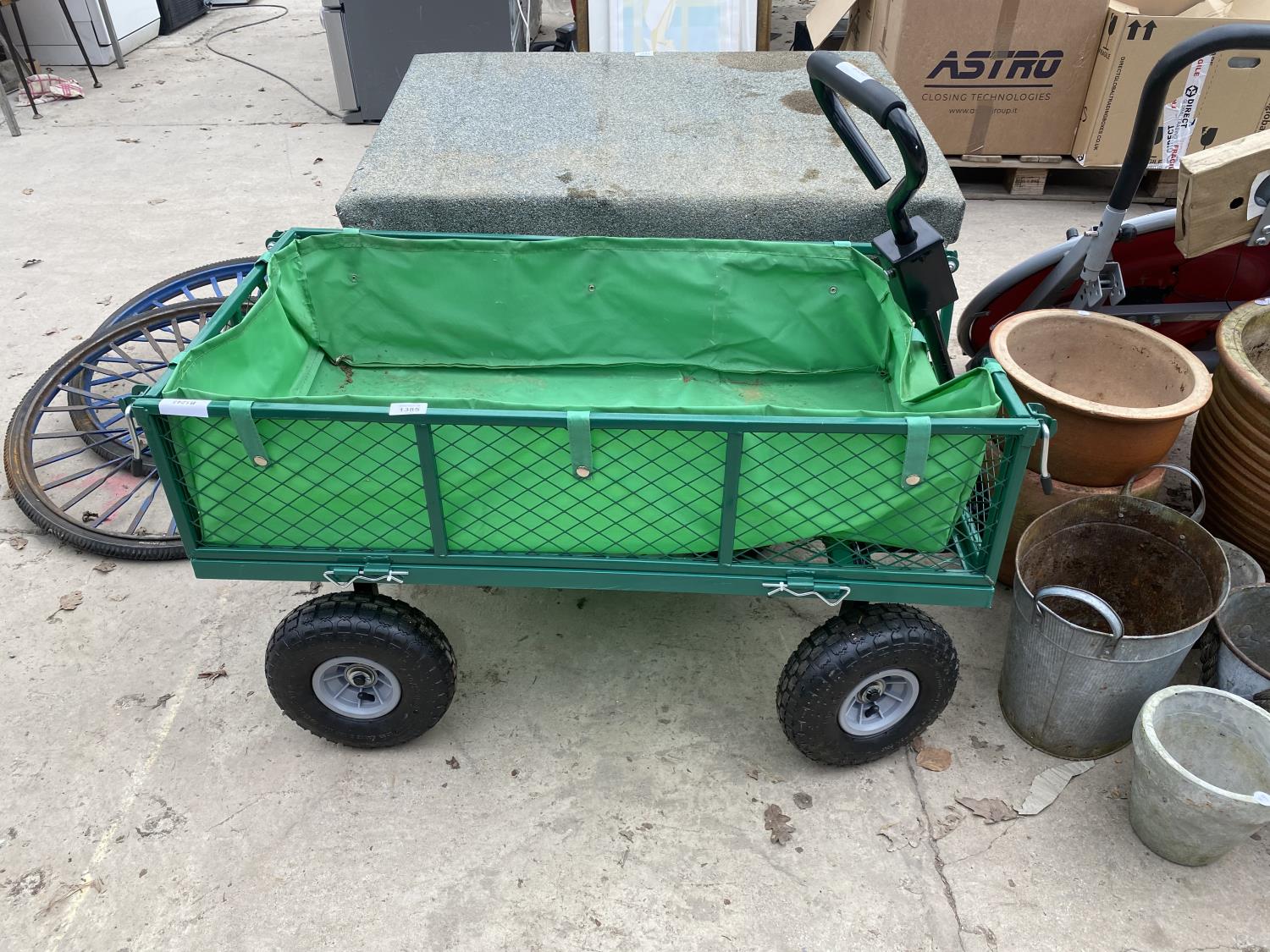 A METAL FOUR WHEELED MARKET GARDENERS TROLLEY