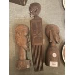 A GROUP OF WOODEN TRIBAL CARVINGS