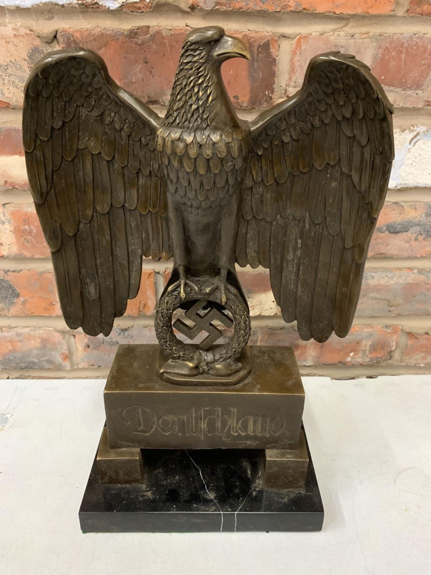 A BRONZE SCUPLTURE OF A GERMAN STATUE WITH EAGLE AND SWASTIKA ON MARBLE BASE - H:44CM INCLUDING BASE