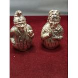A PAIR OF SILVER PLATED CRUETS IN THE DESIGN OF PUNCH AND JUDY