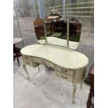 A MODERN CREAM AND GILT KIDNEY SHAPED DRESSING TABLE