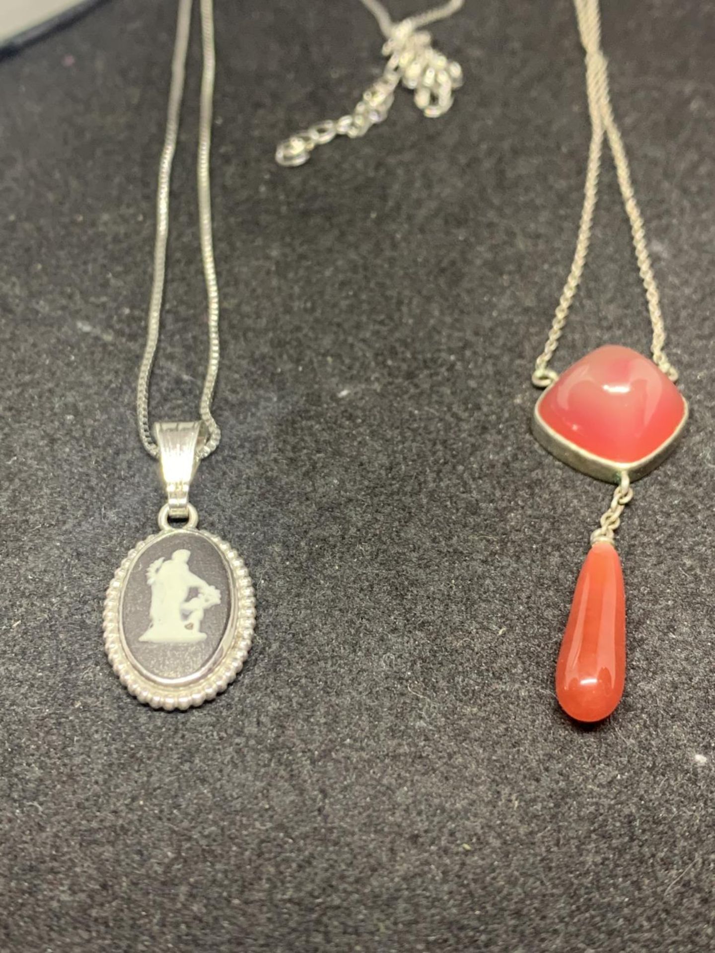 TWO SILVER NECKLACES WITH PENDANTS TO INCLUDE A BLACK JASPERWARE AND A RED STONE WITH DROP - Image 2 of 3
