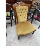 A VICTORIAN SATINWOOD NURSING CHAIR ON TURNED FRONT LEGS