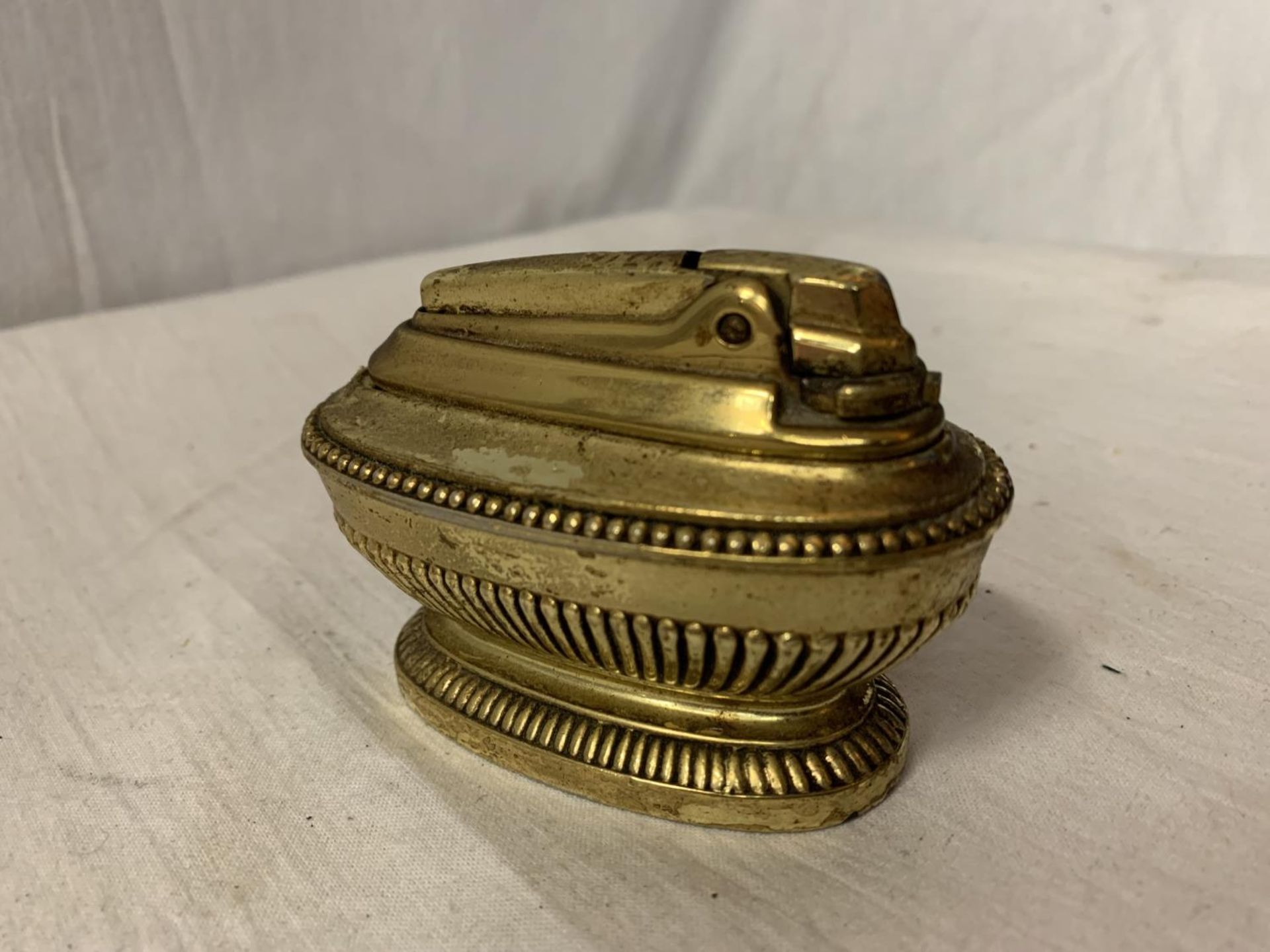 A BRASS RONSON TABLE LIGHTER