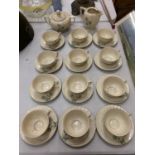 AN ART DECO TEA SET COMPRISING OF CUPS, SAUCERS, MILK JUG AND SUGAR BOWL