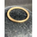 A 9 CARAT YELLOW GOLD WEDDING BAND - 1.6 GRAMS, RING SIZE O/P