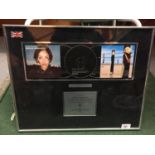 A FRAMED 3 X PLATINUM AWARD FOR 900,000 SALES OF 'LEFT OF THE MIDDLE' 1999 BY NATALIE IMBRUGLIA