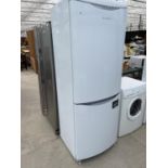 A WHITE HOTPOINT FRIDGE FREEZER, PAT TEST, FUNCTION TEST AND SANITIZED BUT NO WARRANTY GIVEN