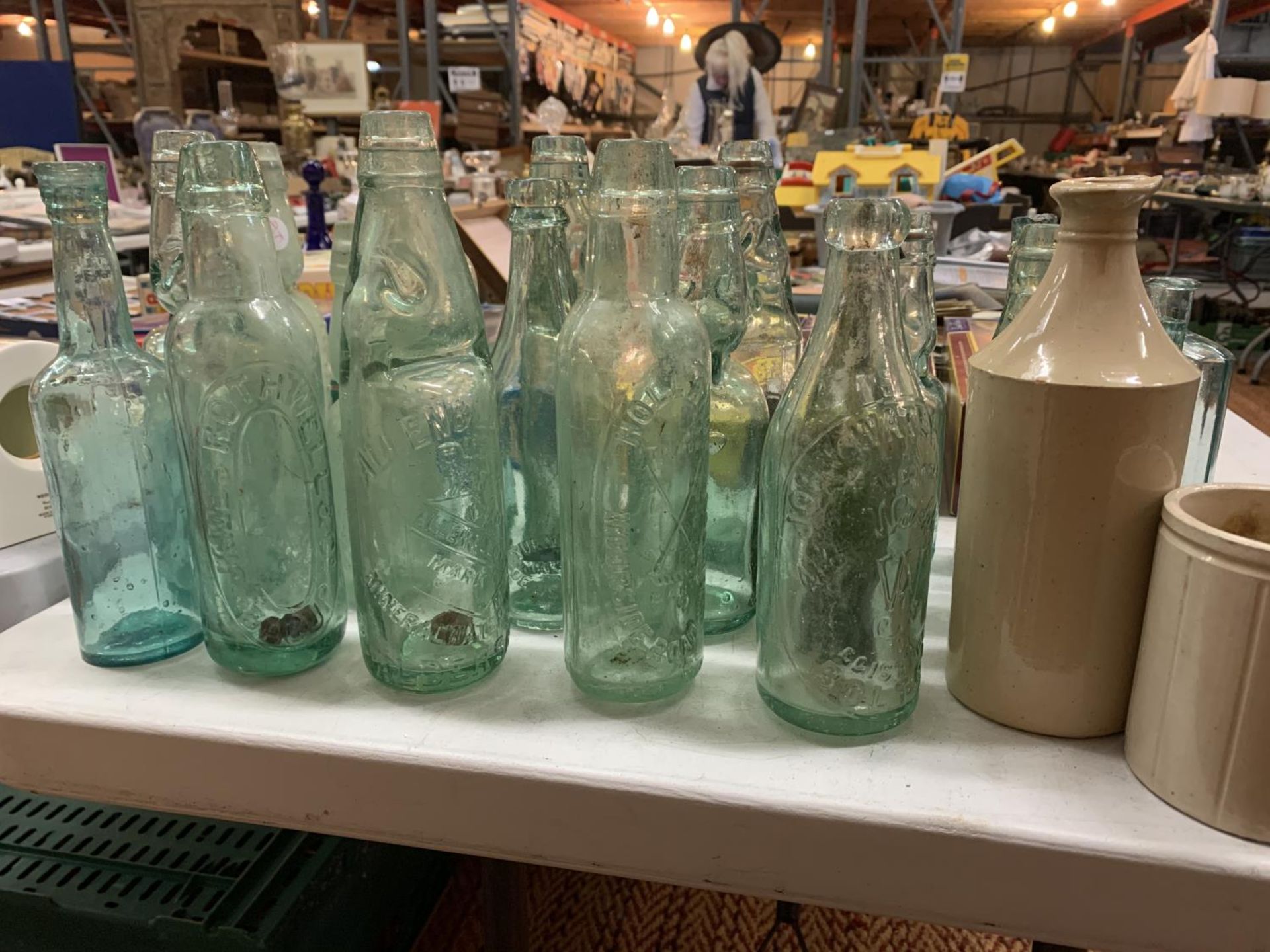 A COLLECTION OF VINTAGE GLASS BOTTLES, STONEWARE JARS AND A SMALL ENAMEL 'STONE'S ORANGE WINE' - Image 3 of 4