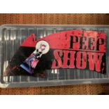 A METAL 'PEEP SHOW' ARROW SIGN - 65.5CM X 29CM