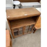 AN OAK BOOKCASE CABINET WITH TWO GLAZED DOORS (I GLASS MISSING)