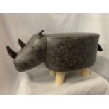 A CHILD'S FAUX FUR FOOTSTOOL IN THE FORM OF A RHINO