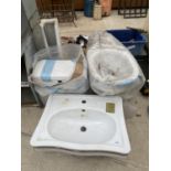 A PEDESTAL WASH BASIN AND A TOILET