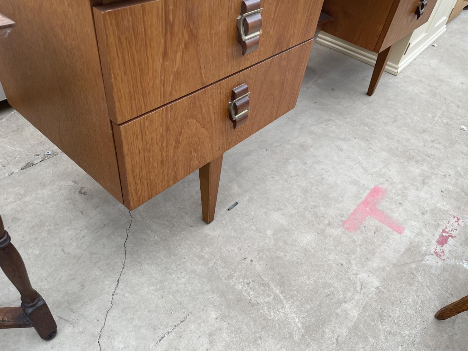 A RETRO TEAK DRESSING TABLE ENCLOSING FOUR DRAWERS WITH BELT BUCKLE STYLE HANDLES, 60" WIDE - Image 4 of 5