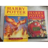 A HARDBACK FIRST EDITION BOOK 'HARRY POTTER AND THE ORDER OF THE PHOENIX' AND A PAPERBACK 'HARRY