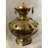 A LARGE BRASS TWIN HANDLED AND LIDDED URN WITH RED STONE DECORATIVE DETAIL H:APPROX. 35CM