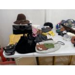 AN ASSORTMENT OF ITEMS TO INCLUDES, HATS, HANDBAGS AND HATS ETC