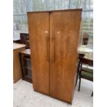 A RETRO TEAK TWO DOOR BEAUTILITY WARDROBE W: 36 INCHES