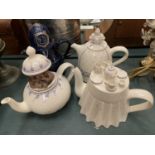 FOUR AUDLEY PORCELAIN TEAPOTS, THREE RELATING TO ALICE IN WONDERLAND AND THE OTHER A POLICEMAN