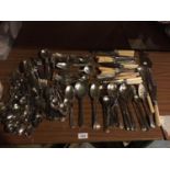 A LARGE QUANTITY OF FLATWARE TO INCLUDE SERVING SPOONS ETC