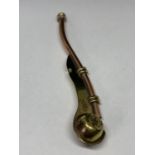 A BRASS AND COPPER BOSSONS WHISTLE