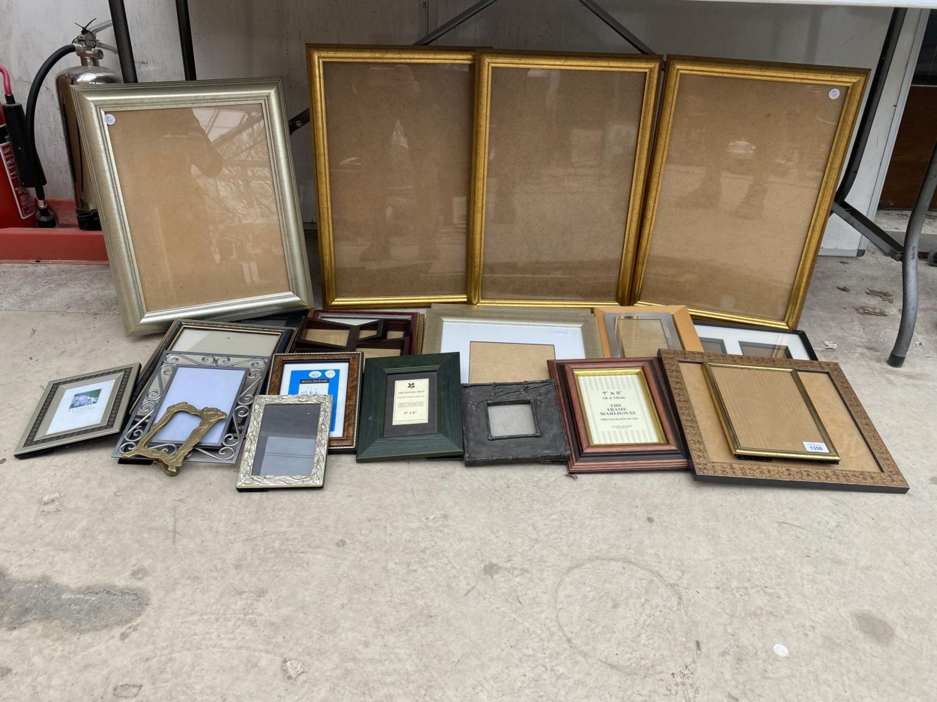 A LARGE ASSORTMENT OF PICTURE FRAMES