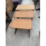 A NEST OF THREE RETRO TEAK TABLES BY 'VALCO'