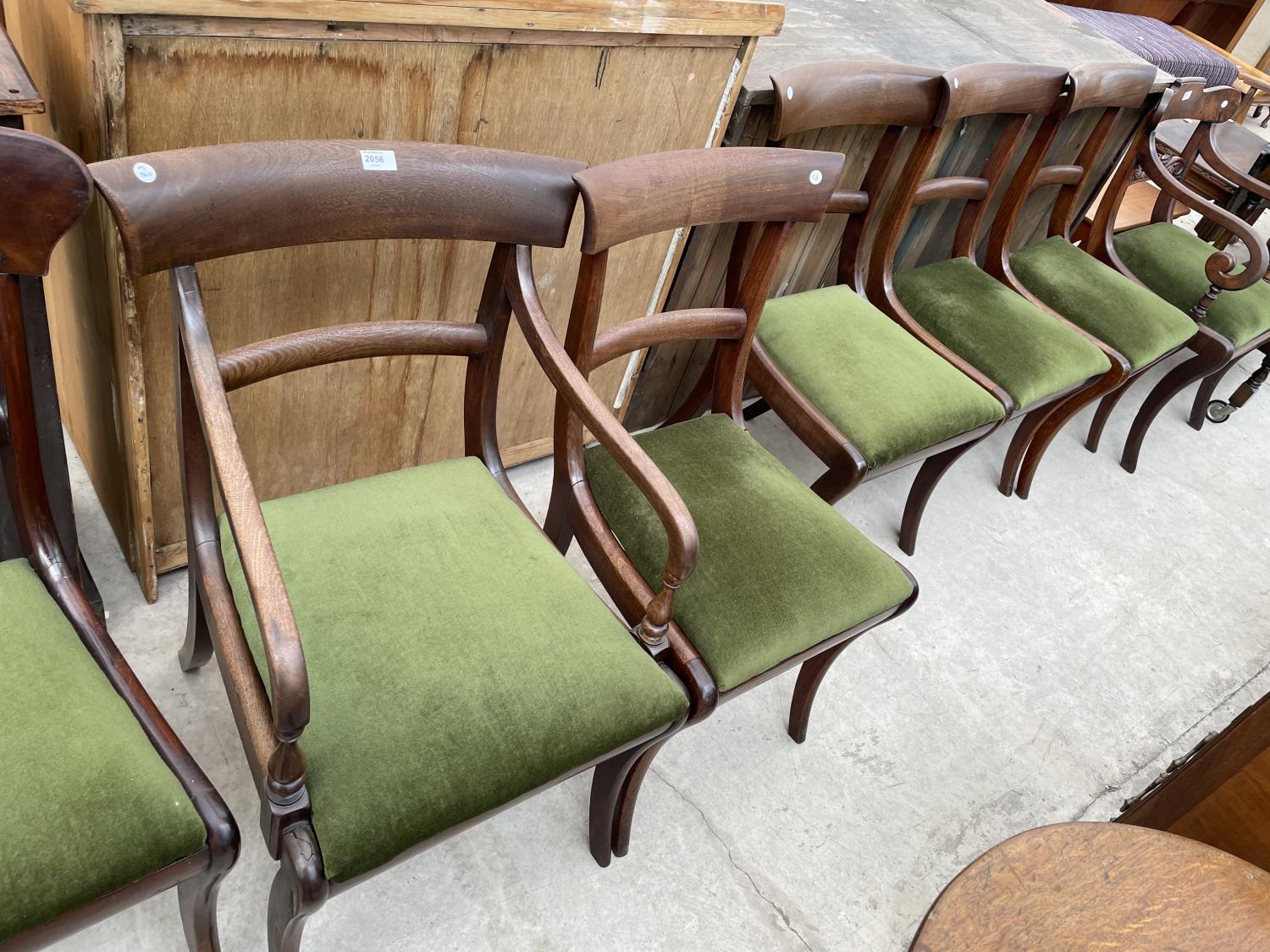 FIVE 19TH CENTURY MAHOGANY DINING CHAIRS ON SABRE LEGS, TO INCLUDE ONE CARVER