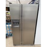 A SILVER SAMSUNG AMERICAN FRIDGE FREEZER WITH ICE DISPENSER PAT TEST, FUNCTION TEST AND SANITIZED