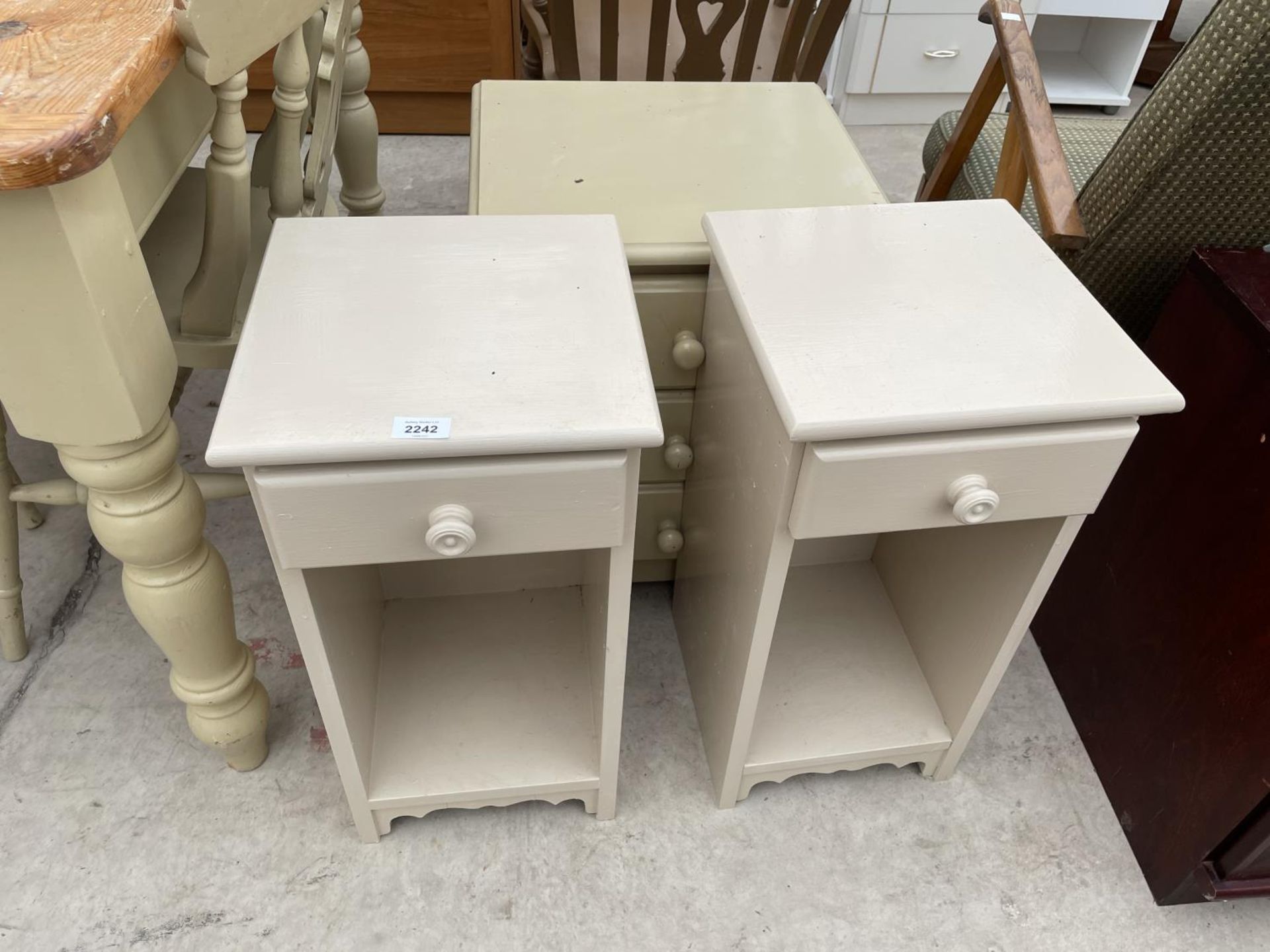 A PAINTED BEDSIDE CHEST AND TWO LOCKERS